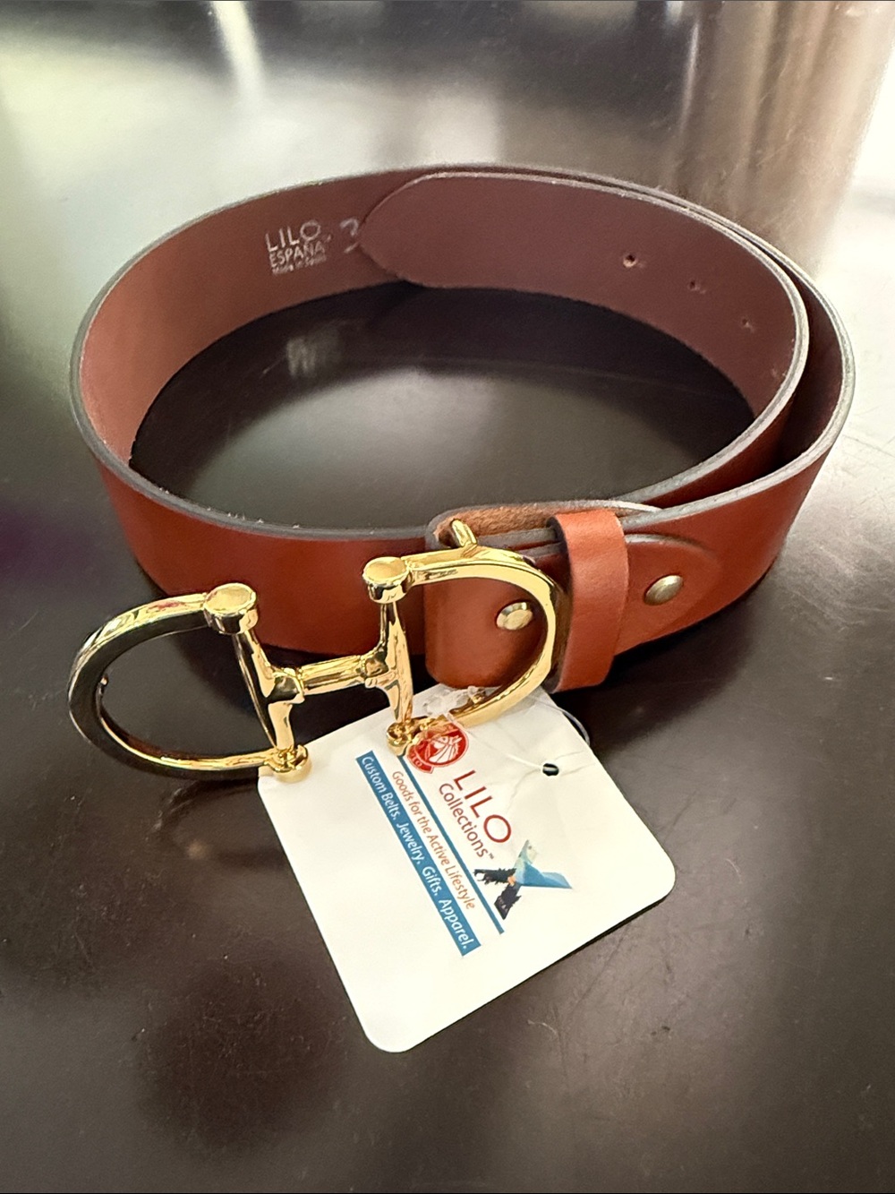 Brown Leather Womenโs Belt with Gold Horsebit Buckle